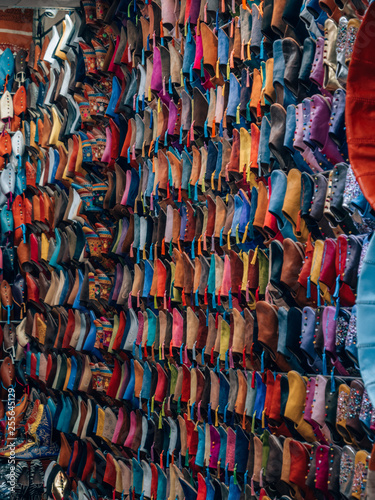 Colorful traditional handmade leather shoes on the market in Marrakech, Morocco.