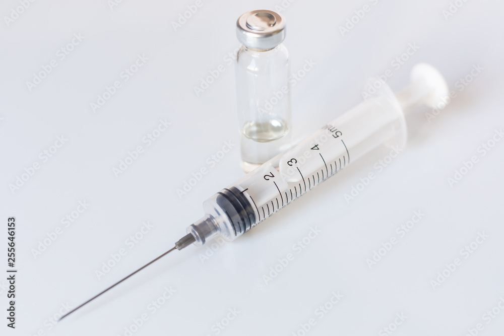 Medical glass vials and syringe for vaccination. Medical concept Medical glass vials and syringe for vaccination. Medical concept