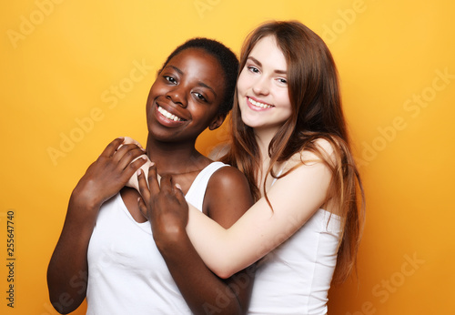 Photo Shot of happy interracial homosexual couple hugging