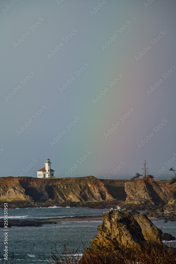 Rainbow over the Cape Arago Lighthouse at the Oregon Coast, located near Coos Bay