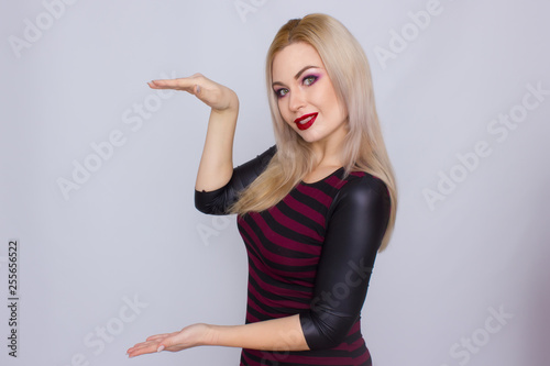 Blonde woman in red and black dress