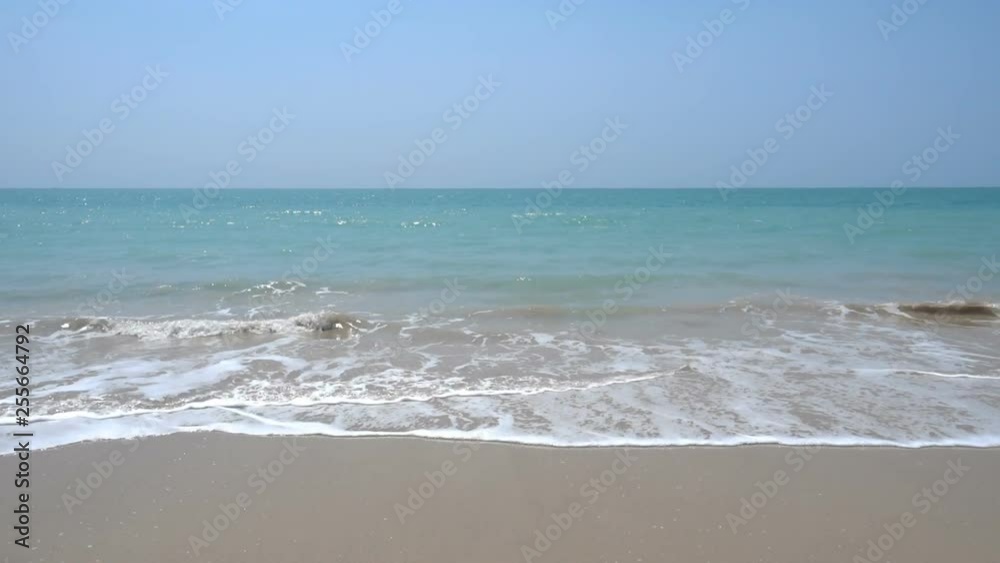 Waves rolling onto an island beach on a clear sunny day Waves rolling onto an island beach on a clear sunny day