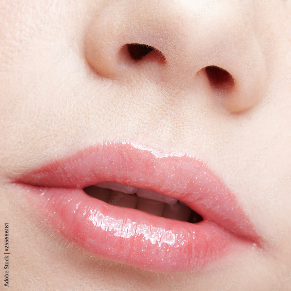 Obraz premium Closeup macro portrait of female part of face. Human woman lips with day beauty makeup