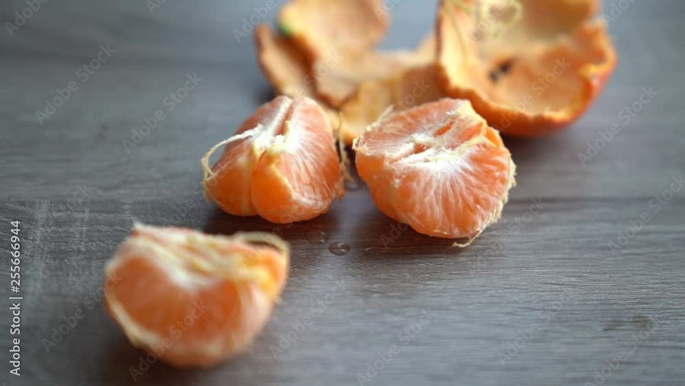 Grabbing an orange slice from a nice table close up Grabbing an orange slice from a nice table close up