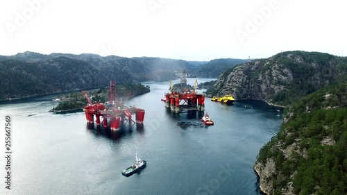 Offshore oil platforms in layup between mountains. photo