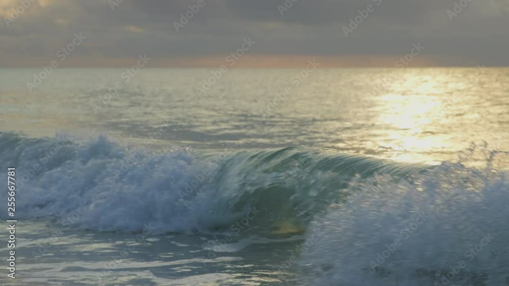 Waves during sunrise on Mombasa beach, Kenya, Handheld shot in slow motion. Waves during sunrise on Mombasa beach, Kenya, Handheld shot in slow motion.
