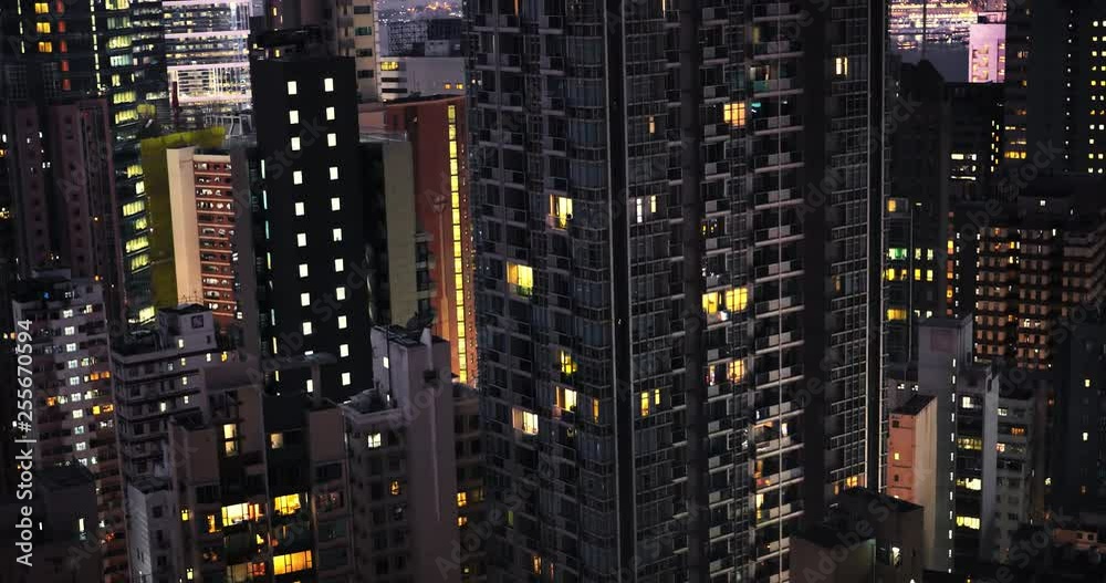 Night buildings exterior and city panorama of Hong Kong. Modern architecture and urban development in Asia metropolis Night buildings exterior and city panorama of Hong Kong. Modern architecture and urban development in Asia metropolis
