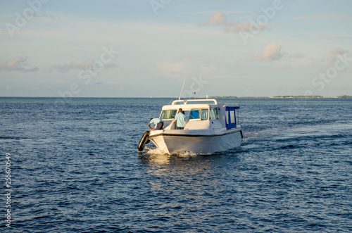 The boat in the open Indian Ocean the island of Maldives goes on waves © rosetata