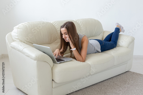 Freelance and people concept - Young woman working at laptop at home © satura_