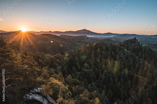 Summer landscape in mountains with the sun