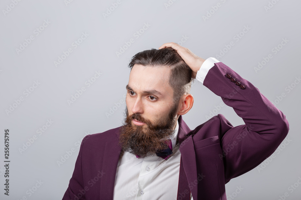 People, style and fashion concept - Portrait of bearded man dressed in white shirt over grey background People, style and fashion concept - Portrait of bearded man dressed in white shirt over grey background