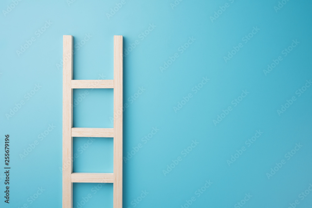 Wood staircase isolated on blue wall texture background business growth concept photo object design Wood staircase isolated on blue wall texture background business growth concept photo object design
