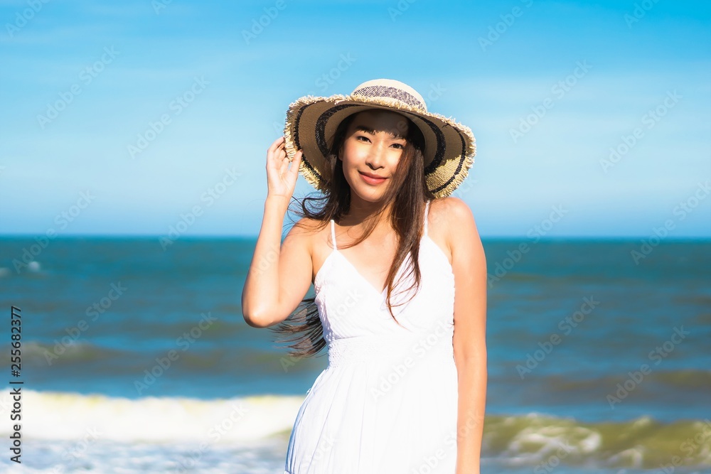 Portrait beautiful young asian woman happy smile relax around neary beach and sea