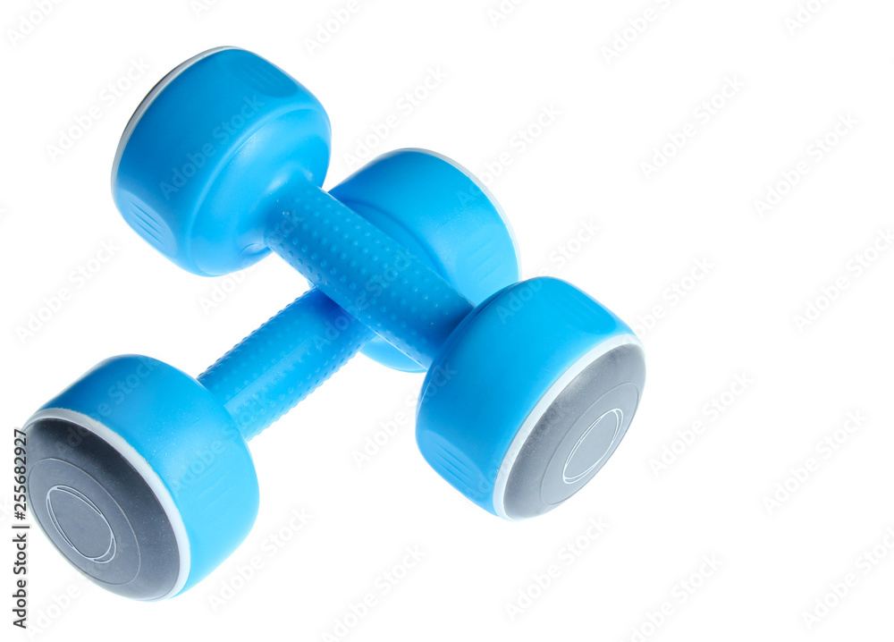 Two plastic blue dumbbells isolated on a white background. Sports concept. Two plastic blue dumbbells isolated on a white background. Sports concept.