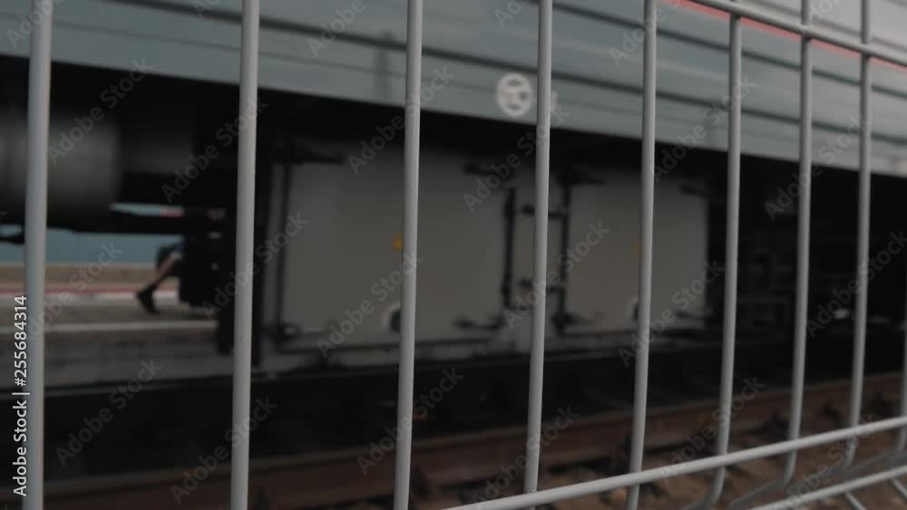 Safety fence on the station platform. Train movement by rail Safety fence on the station platform. Train movement by rail