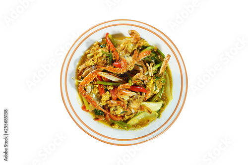 Top view of Fried crab with curry powder, popular seafood menu in asia. Fried crab with curry powder, onion and egg. Image with path isolate on white background. Selective focus and shoot in studio.