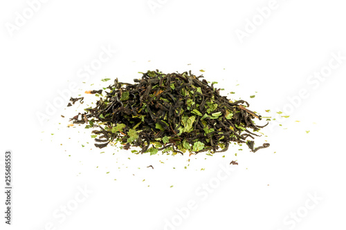 Aromatic crumbly Handful of Dry tea leaves isolated on white background. Green and black dry tea, isolated on white