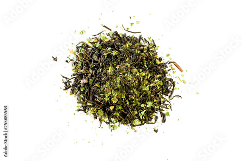Aromatic crumbly Handful of Dry tea leaves isolated on white background. Green and black dry tea, isolated on white