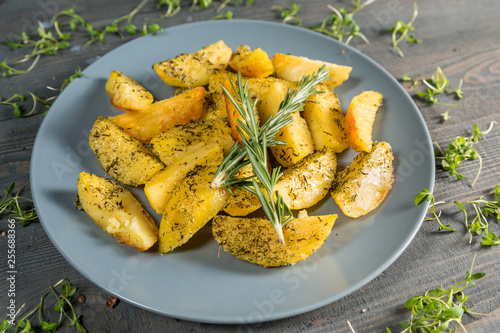Fried potato wedges with herbs 