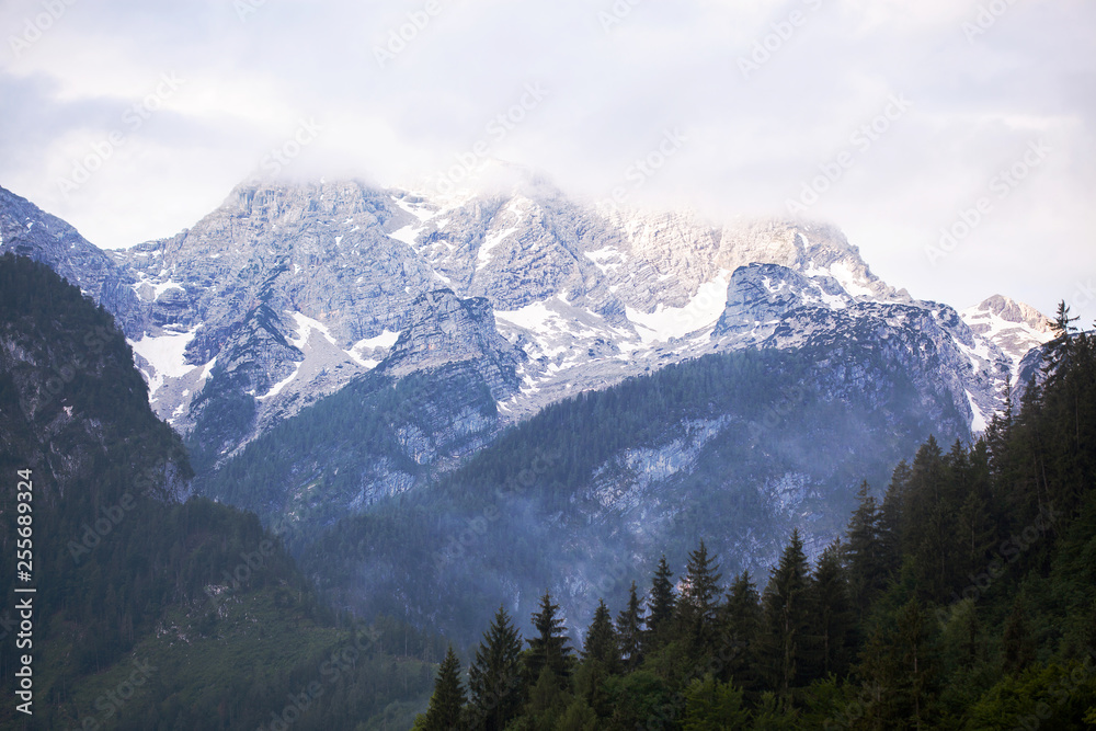 View of the snowy Alpine mountains in the evening