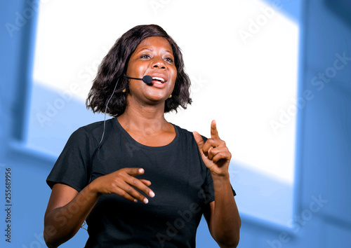 Fototapeta successful black afro American entrepreneur woman with headset speaking in audit