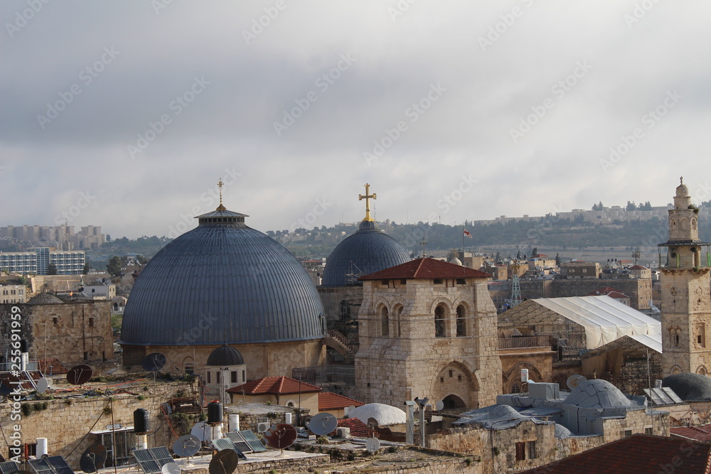 Fototapeta premium Sky over Jerusalem old town. View on the Jerusalem old town from the rooftop in the early morning