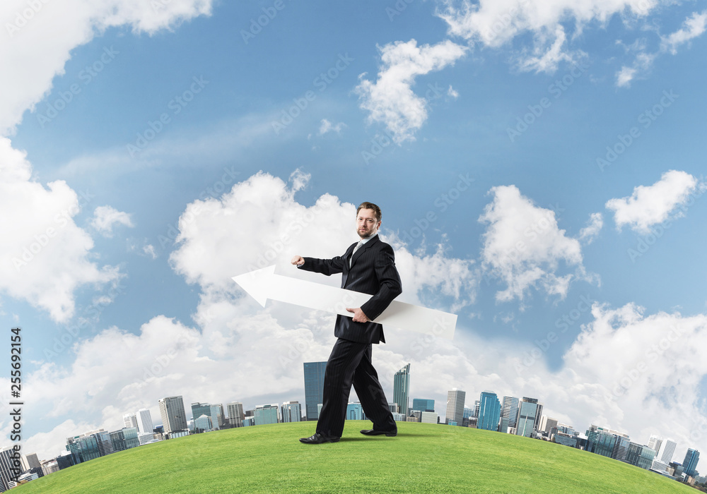 Conceptual image of businessman pointing aside Conceptual image of businessman pointing aside