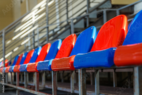 multi-colored plastic seats on the podium