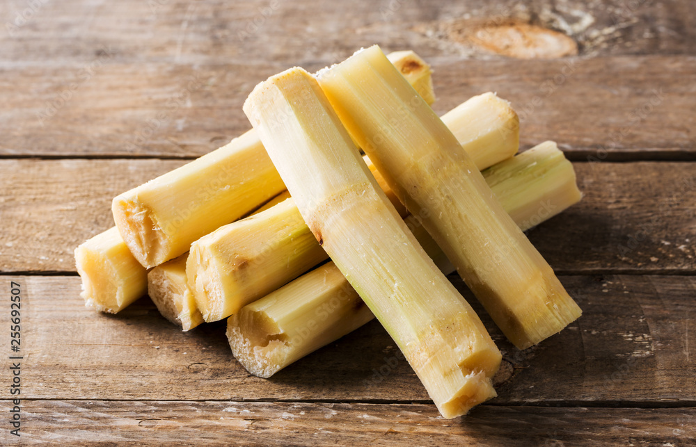 Fototapeta premium Sugar Cane on Wooden Table