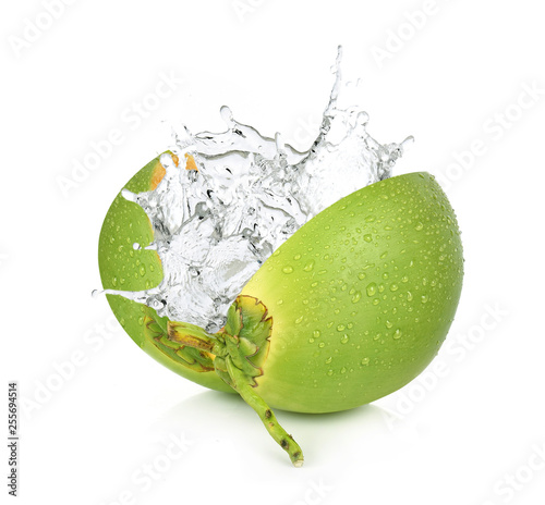 Green coconut with water splash isolated on white background.