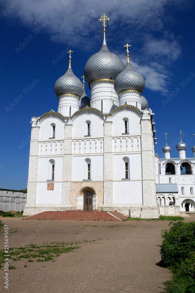 On a sunny summer day view of the Assumption Cathedral and the bell tower of the Rostov Kremlin. Gold ring of Russia