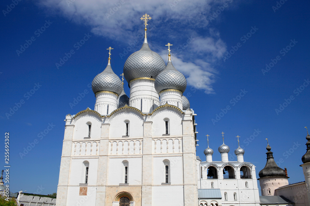 On a sunny summer day view of the Assumption Cathedral, the bell tower and the towers of the Rostov Kremlin. Travel around the Golden Ring of Russia