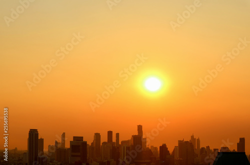 Stunning sunset sky over the silhouette of skyscrapers of Bangkok downtown 