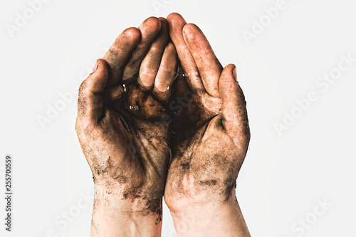 Hands of a child with dirty water. Epidemic, viruses, bacteria in water, diseases of dirty hands. Problems of environmental pollution ecology photo