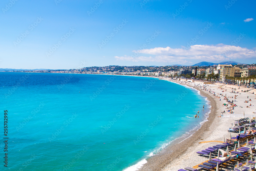 Nice, beautiful beach, French Riviera, Cote d'Azur or Coast of Azure. Bright turquoise water and public beach. 