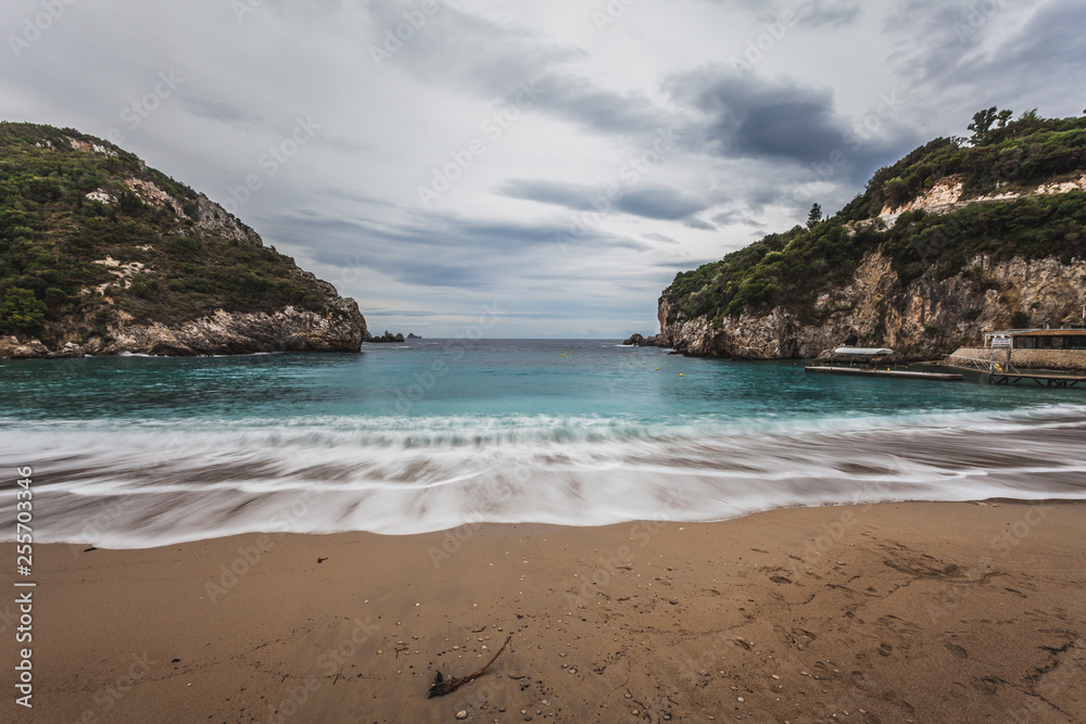 Obraz premium Paleokastritsa beach with Kolyviri island background on a rainy day
