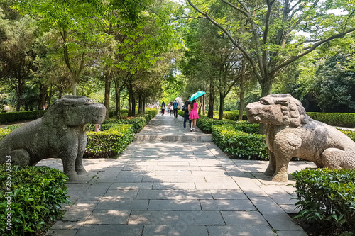 May 2017 – Nanjing, Jiangsu, China – tourists walking along the sacred way in the Ming Xiaoling mausoleum on mount Zijin. Ming Xiaoling is a UNESCO World Heritage Site photo