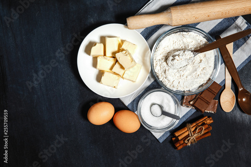 Ingredients for baking a chocolate cake or brownie on a dark background