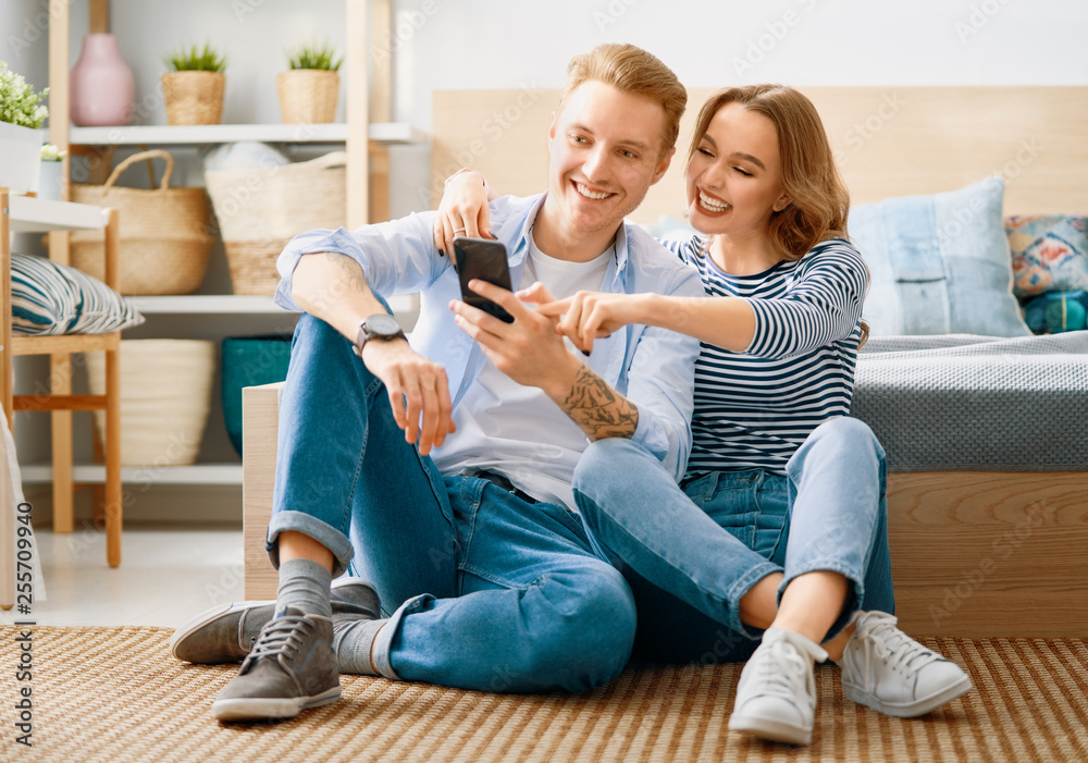 couple is using smartphone at home couple is using smartphone at home