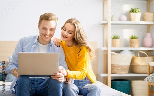 couple is using a laptop