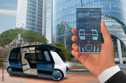Control of autonomous taxi by futuristic smartphone with mobile app . Concept.