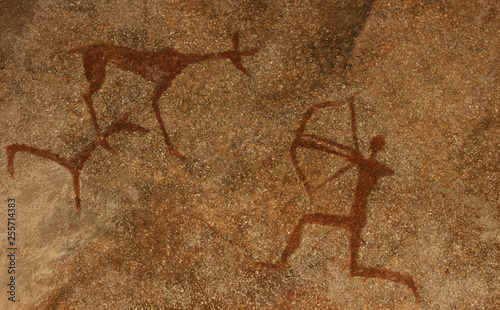 Image of ancient hunting on the cave wall. history of antiquities. archaeology.