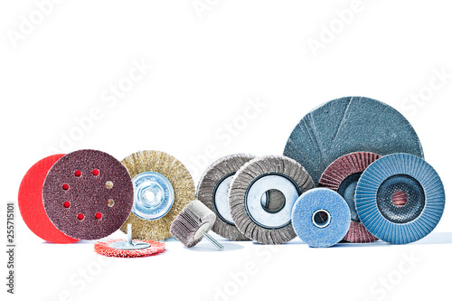 Photos big set of rotary abrasive wheels construction tools isolated on white