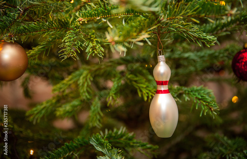 glass bowling pins as decoration on a Christmas tree photo