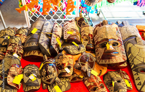 Wooden masks in the local market, Rarotonga, Aitutaki, Cook Islands. With selective focus.