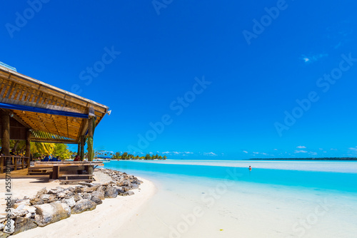 View of the sandy beach with a sandbank  Aitutaki island  Cook Islands  South Pacific. Copy space for text.