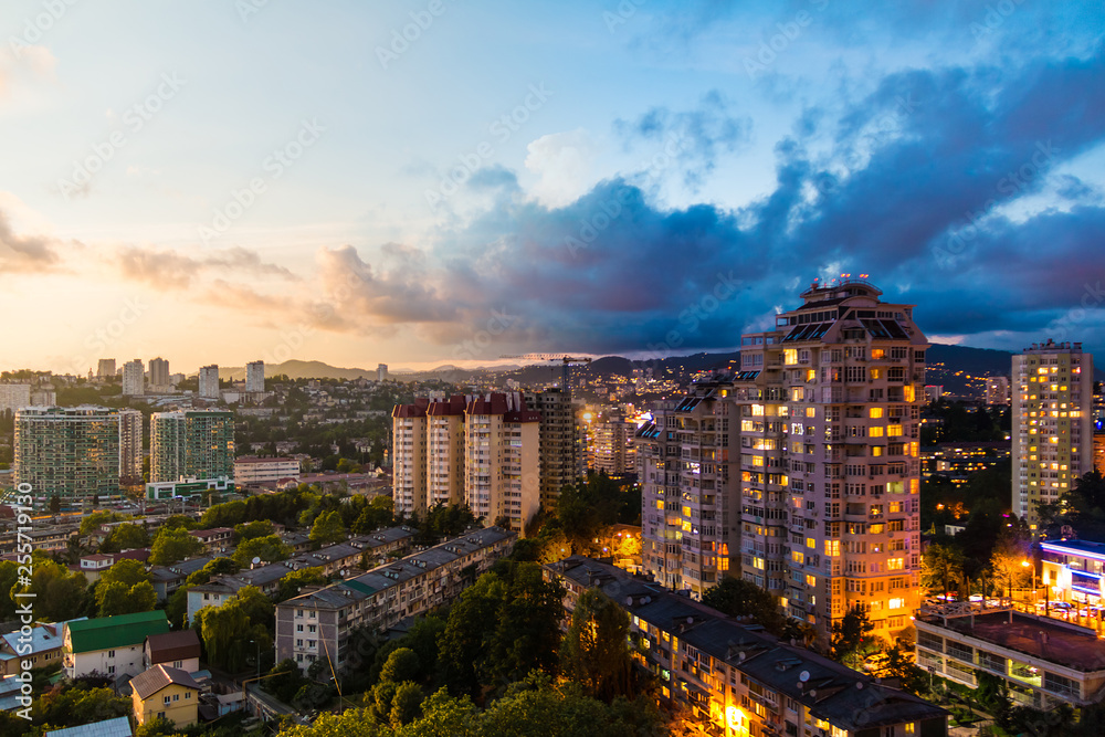Time-lapse collage of day to night transition. Aerial view of the apartment district of the city of Sochi, Russia