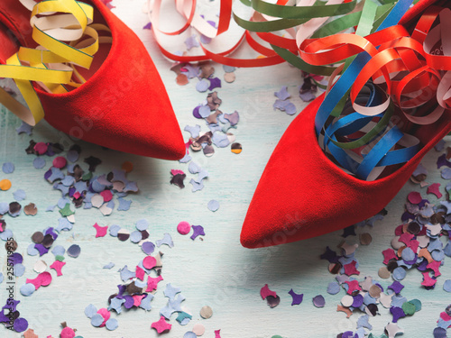 Party symbols flat lay with red shoes