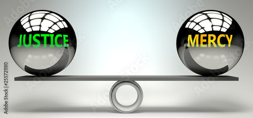 Foto Justice and mercy balance, harmony and relation pictured as two equal balls with