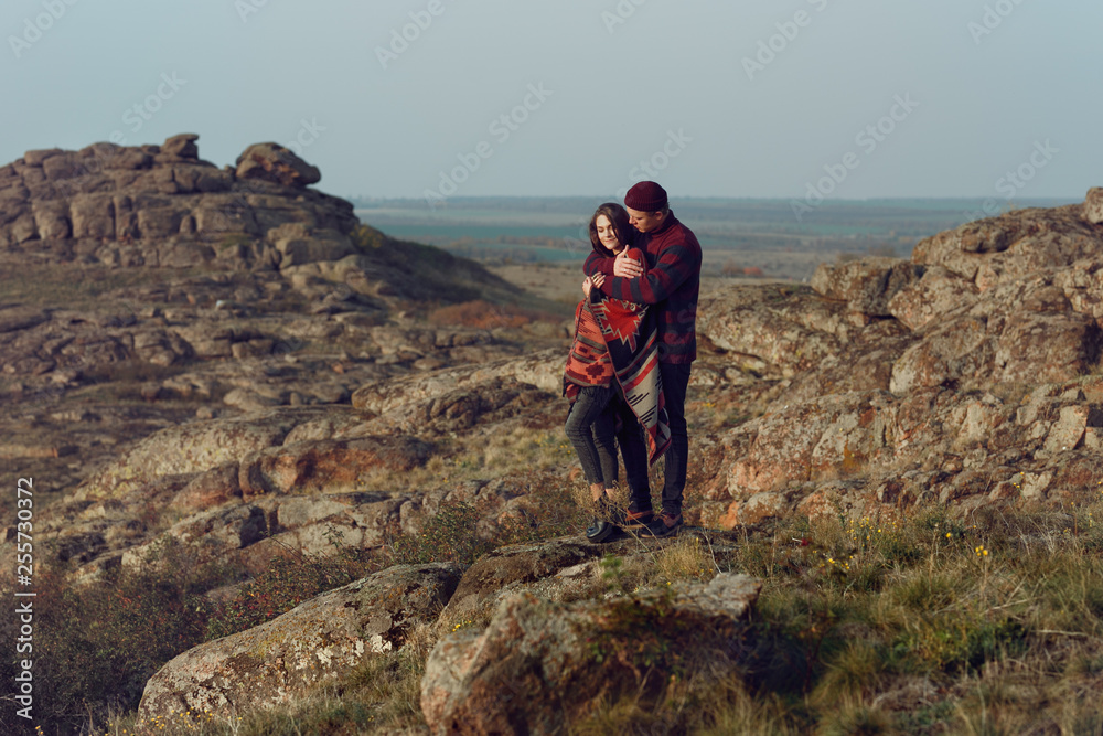 Obraz premium young couple in love walking in the wild wearing city clothes
